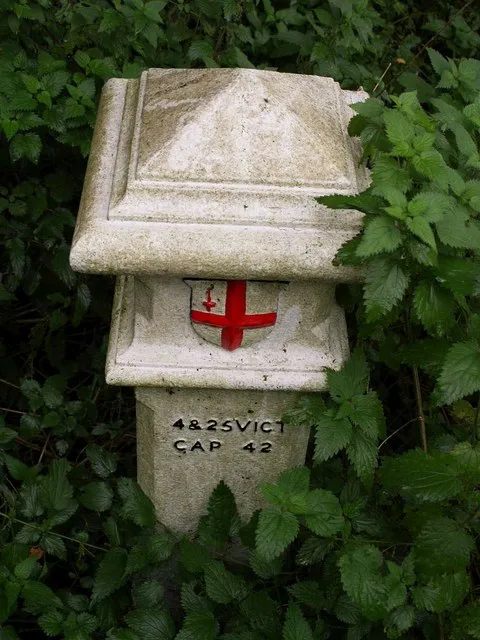 Coal tax post Number 157 as listed at http://www.coaldutyposts.org.uk/images/pdf/Extant_Posts_Report.pdf , just east of Banstead bridleway 45 a little south of where it passes under the railway line up Chipstead valley.