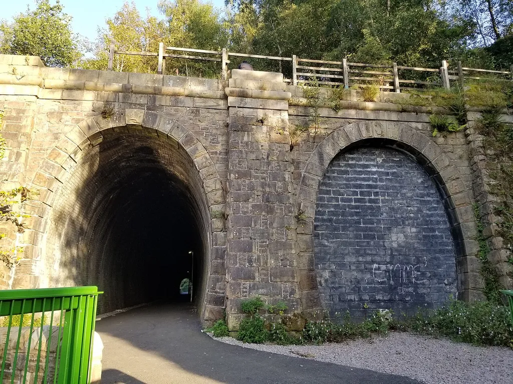 Entrances To Railway Tunnels .mw-parser-output .messagebox{margin:4px 0;width:auto;border-collapse:collapse;border:2px solid var(--border-color-progressive,#6485d1);background-color:var(--background-color-neutral-subtle,#fbfcff);color:var(--color-base,#202122);box-sizing:border-box;border-inline-start-width:8px}.mw-parser-output .messagebox.mbox-small{font-size:88%;line-height:1.25em}.mw-parser-output .mbox-warning,.mw-parser-output .mbox-speedy{border:2px solid var(--border-color-error,#b22222);background:var(--background-color-error-subtle,#ffdbdb);border-inline-start-width:8px}.mw-parser-output .mbox-serious,.mw-parser-output .mbox-delete,.mw-parser-output .mbox-stop{border:2px solid var(--border-color-error,#b22222);border-inline-start-width:8px}.mw-parser-output .mbox-issue,.mw-parser-output .mbox-content{border:2px solid #f28500;background:var(--background-color-warning-subtle,#ffe);border-inline-start-width:8px}.mw-parser-output .mbox-query,.mw-parser-output .mbox-style{border:2px solid #f4c430;background:var(--background-color-warning-subtle,#ffe);border-inline-start-width:8px}.mw-parser-output .mbox-shit{border:2px solid #960;border-inline-start-width:8px}.mw-parser-output .mbox-license{border:2px solid #88a;border-inline-start-width:initial}.mw-parser-output .mbox-legal{border:2px solid var(--border-color-notice,#666);background:var(--background-color-base,#fff);border-inline-start-width:8px}.mw-parser-output .mbox-honor{border:2px solid #ca3;background:var(--background-color-warning-subtle,#fcf4db);border-inline-start-width:8px}.mw-parser-output .mbox-growth{border:2px solid #8d4;background:var(--background-color-success-subtle,#d5fdf4);border-inline-start-width:8px}.mw-parser-output .mbox-move{border:2px solid #93c;border-inline-start-width:8px}.mw-parser-output .mbox-protection,.mw-parser-output .mbox-message{border:2px solid var(--border-color-base,#aaa);border-inline-start-width:8px}.mw-parser-output .messagebox .mbox-text{border:none;padding:0.25em 0