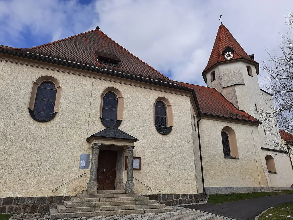 The Church "Katholische Pfarrkirche St. Johannes Baptist" with the Main Door in focus. The Church is located in Großkonreuth.