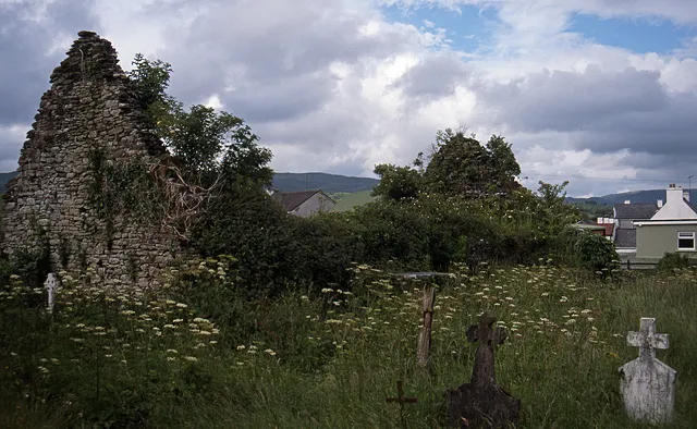 Kilgarvan ruined church. On the east side of the village behind the Post Office, stands this ruined church and its graveyard.