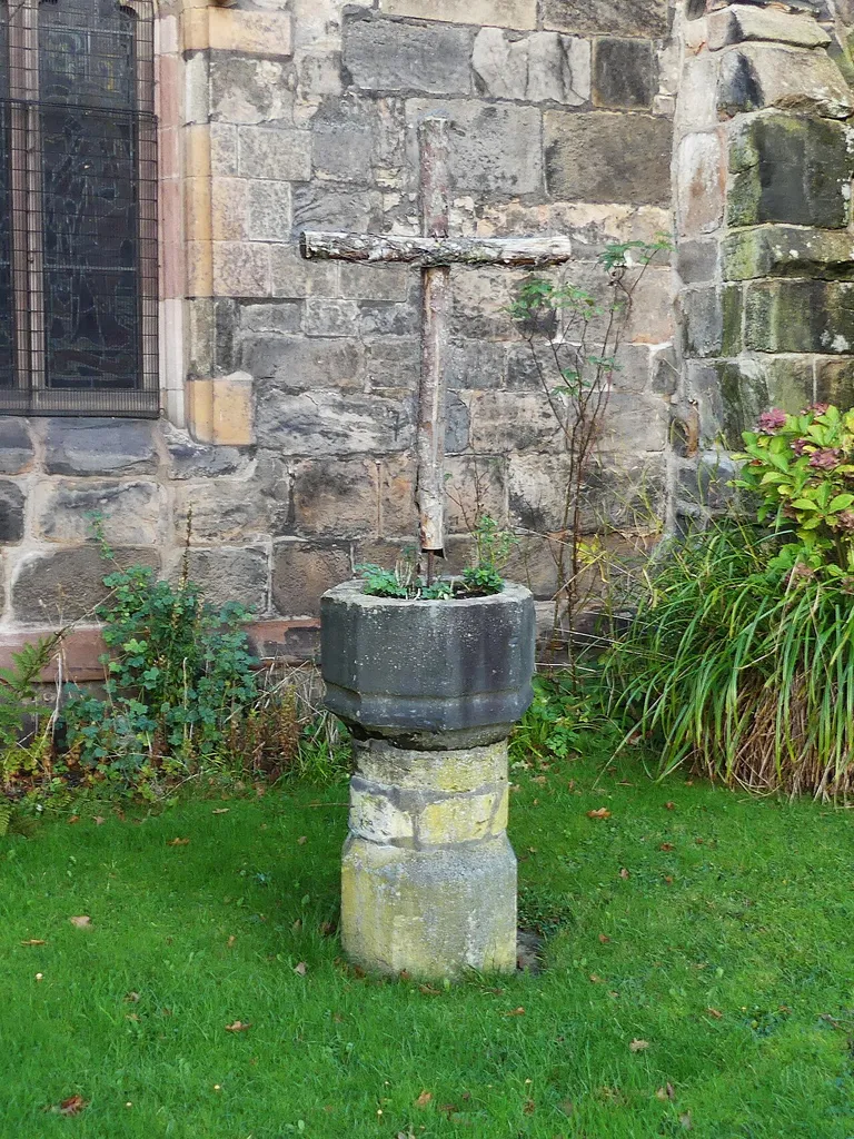 Former font in St. Bartholomew's Churchyard: Grade II listed building in Wilmslow, Cheshire. .mw-parser-output .messagebox{margin:4px 0;width:auto;border-collapse:collapse;border:2px solid var(--border-color-progressive,#6485d1);background-color:var(--background-color-neutral-subtle,#fbfcff);color:var(--color-base,#202122);box-sizing:border-box;border-inline-start-width:8px}.mw-parser-output .messagebox.mbox-small{font-size:88%;line-height:1.25em}.mw-parser-output .mbox-warning,.mw-parser-output .mbox-speedy{border:2px solid var(--border-color-error,#b22222);background:var(--background-color-error-subtle,#ffdbdb);border-inline-start-width:8px}.mw-parser-output .mbox-serious,.mw-parser-output .mbox-delete,.mw-parser-output .mbox-stop{border:2px solid var(--border-color-error,#b22222);border-inline-start-width:8px}.mw-parser-output .mbox-issue,.mw-parser-output .mbox-content{border:2px solid #f28500;background:var(--background-color-warning-subtle,#ffe);border-inline-start-width:8px}.mw-parser-output .mbox-query,.mw-parser-output .mbox-style{border:2px solid #f4c430;background:var(--background-color-warning-subtle,#ffe);border-inline-start-width:8px}.mw-parser-output .mbox-shit{border:2px solid #960;border-inline-start-width:8px}.mw-parser-output .mbox-license{border:2px solid #88a;border-inline-start-width:initial}.mw-parser-output .mbox-legal{border:2px solid var(--border-color-notice,#666);background:var(--background-color-base,#fff);border-inline-start-width:8px}.mw-parser-output .mbox-honor{border:2px solid #ca3;background:var(--background-color-warning-subtle,#fcf4db);border-inline-start-width:8px}.mw-parser-output .mbox-growth{border:2px solid #8d4;background:var(--background-color-success-subtle,#d5fdf4);border-inline-start-width:8px}.mw-parser-output .mbox-move{border:2px solid #93c;border-inline-start-width:8px}.mw-parser-output .mbox-protection,.mw-parser-output .mbox-message{border:2px solid var(--border-color-base,#aaa);border-inline-start-width:8px}.mw-p