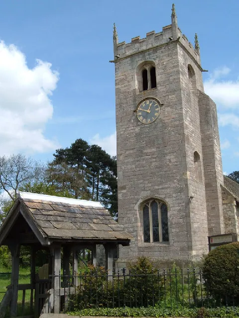 Lychgate and west tower of All Saints' parish church, Long Marston Church, North Yorkshire, seen from the southwest