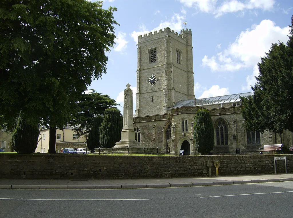 St Mary's parish church, Axminister, Devon, seen from the north.In front of the church is the First World War memorial.