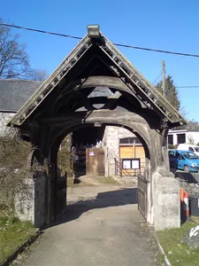Lychgate and Churchyard Walls, including Sundial Base, at St Dyfnog's Church