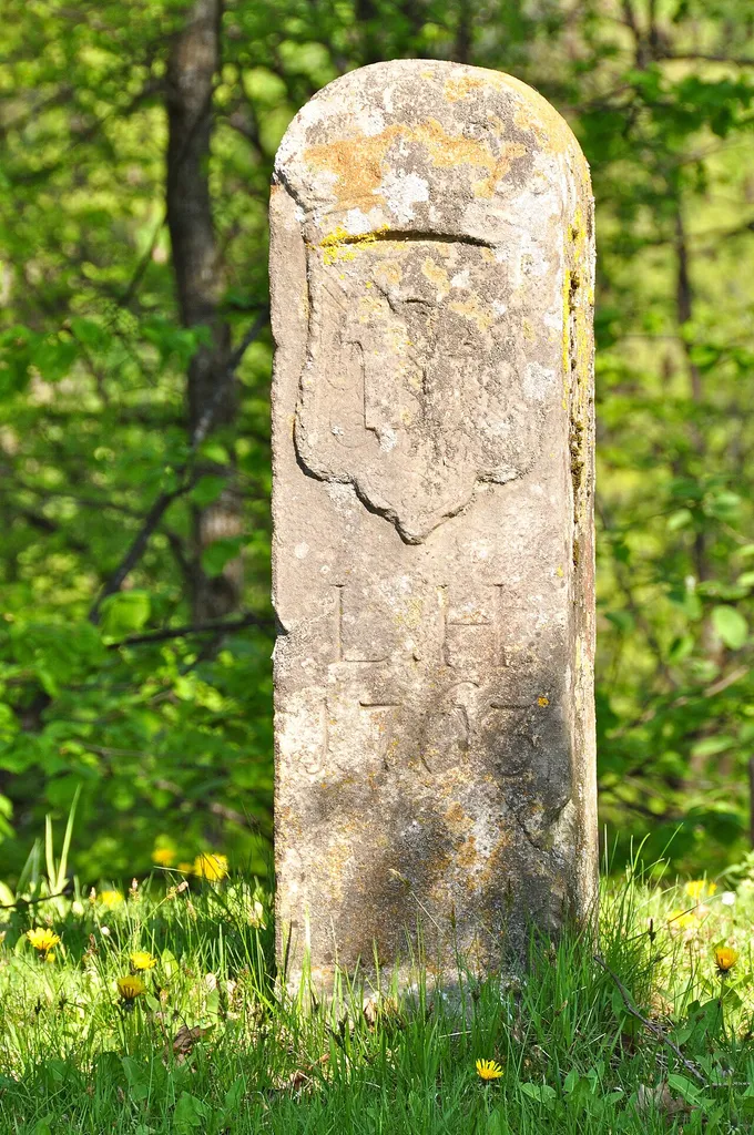 Boundary stone “L.H. 1763” between Hollenburg and Viktring on the Muehlenstrasse #2 at Thal, municipality Köttmannsdorf, Klagenfurt Land, Carinthia, Austria