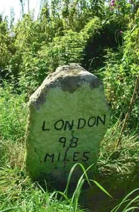 Milestone, 50yds S of wooden gate into St Peter's churchyard