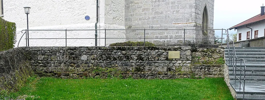 Reconstruced wall of Roman fort BEDAIUM in North-West of parish church St. Thomas and Stephan in Seebruck at lake Chiemsee, Upper Bavaria.