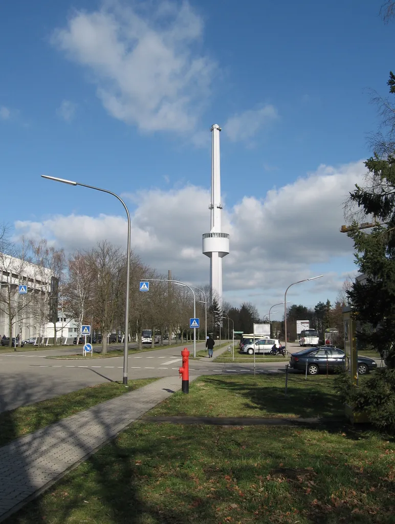 The picture shows the en:Forschungszentrum Karlsruhe, a German science center, member of the en:Helmholtz-Gemeinschaft. This picture: The main street of Forschungszentrum Karlsruhe. You can also see the en:water tower