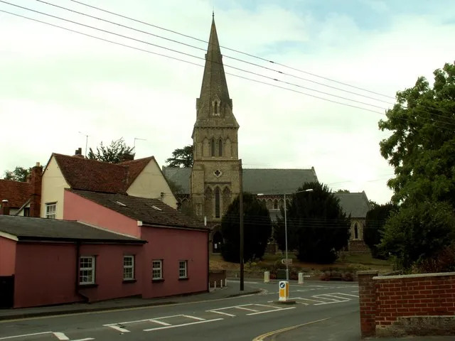 Holy Trinity church, Halstead, Essex. The church in this picture was designed by George Gilbert Scott &amp; Moffatt and built in 1843-4. It stands at the southern end of Halstead. The main road in the picture is A.131 and the turning to the left, in front of the church, is the road to Gosfield.