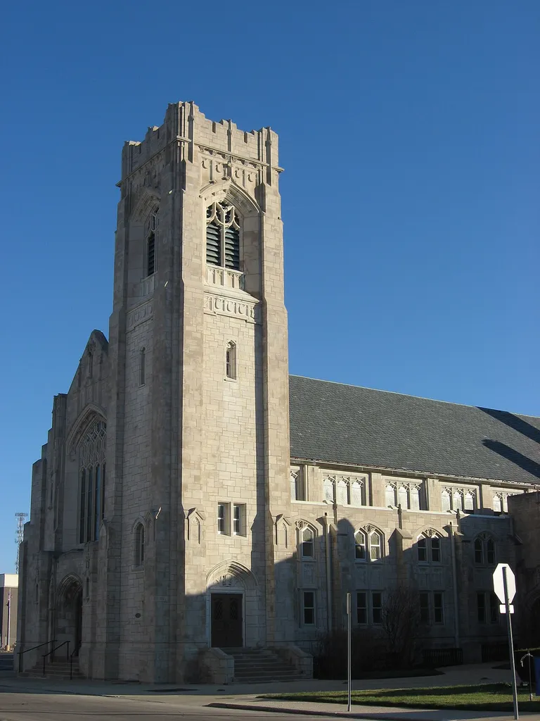 Front and western side of First Baptist Church, located at 309 E. Adams Street in Muncie, Indiana, United States. Built in 1928, it is listed on the National Register of Historic Places.
