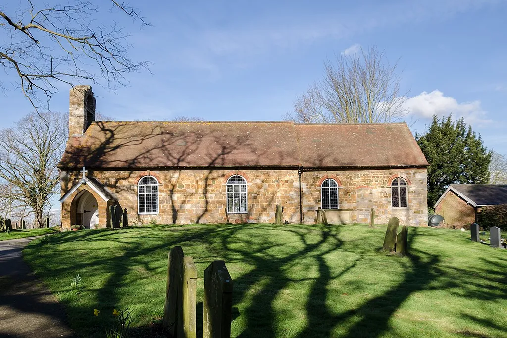 Built circa 1796, refitted 1895 and south porch built in 1924. Has a western belcote.