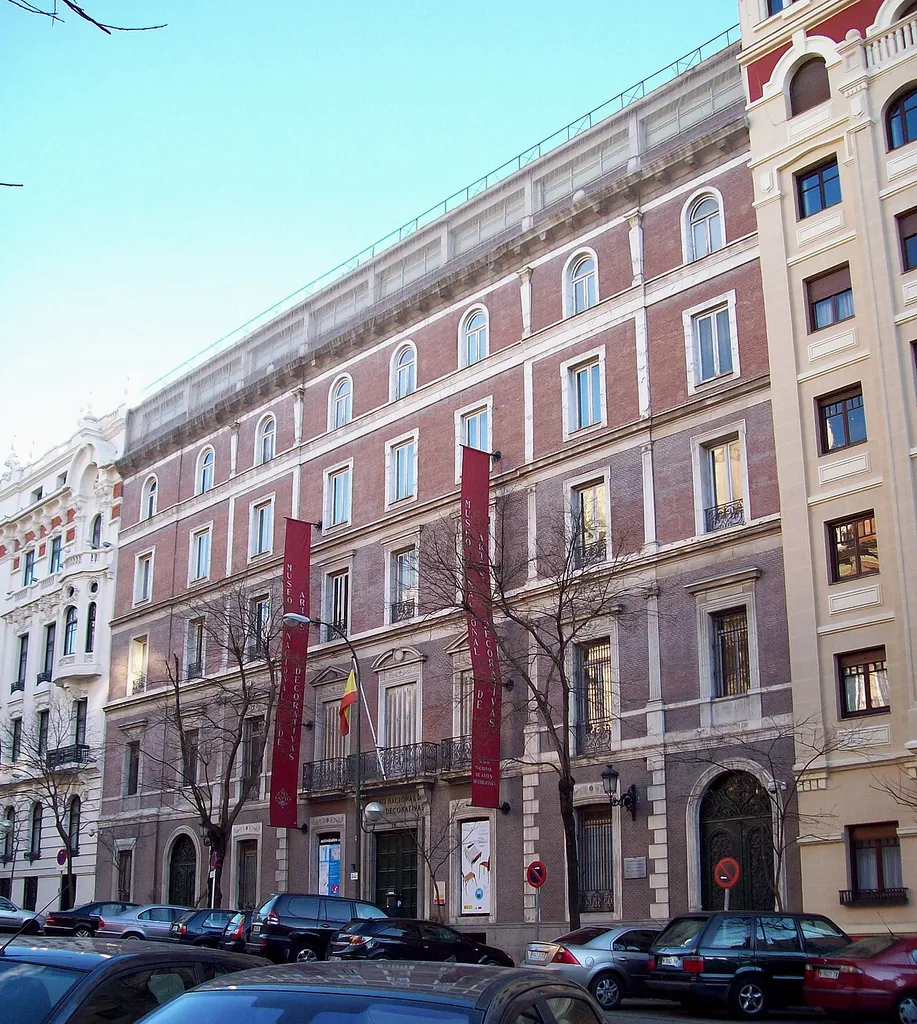 National Museum of Decorative Arts of Spain, at 12 Calle de Montalbán (street, Retiro district) in Madrid. Building was made in the last third of the 19th century as a palace–house for the Duchess of Santoña, and extended in 1909 as a teacher-training school. It was opened as a museum in 1932, and declared an Artistic Historical Monument in 1962.
