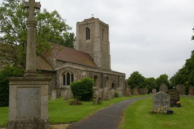 St Bartholomew's parish church, Great Stukeley, Huntingdonshire, with the parish war memorial in the foreground