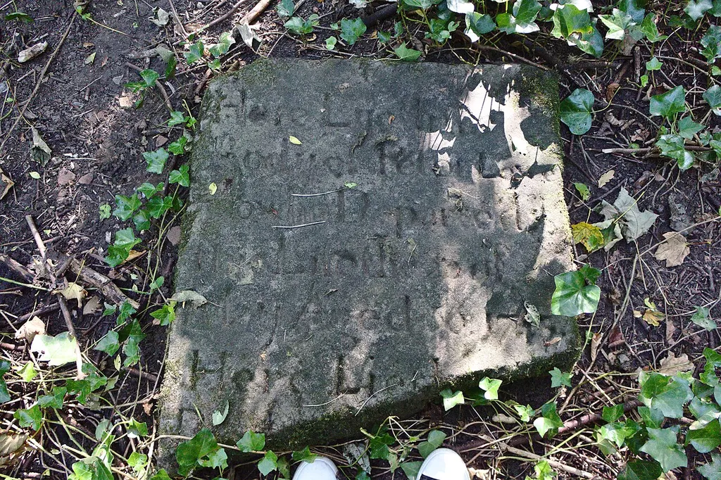 This is the only surviving gravestone of Overchurch church with anything approaching a legible inscription- even so, it reads "Here lyeth ... Peter .... departed ... 1745", then a second inscription begins but is incomplete due to breakage.Link