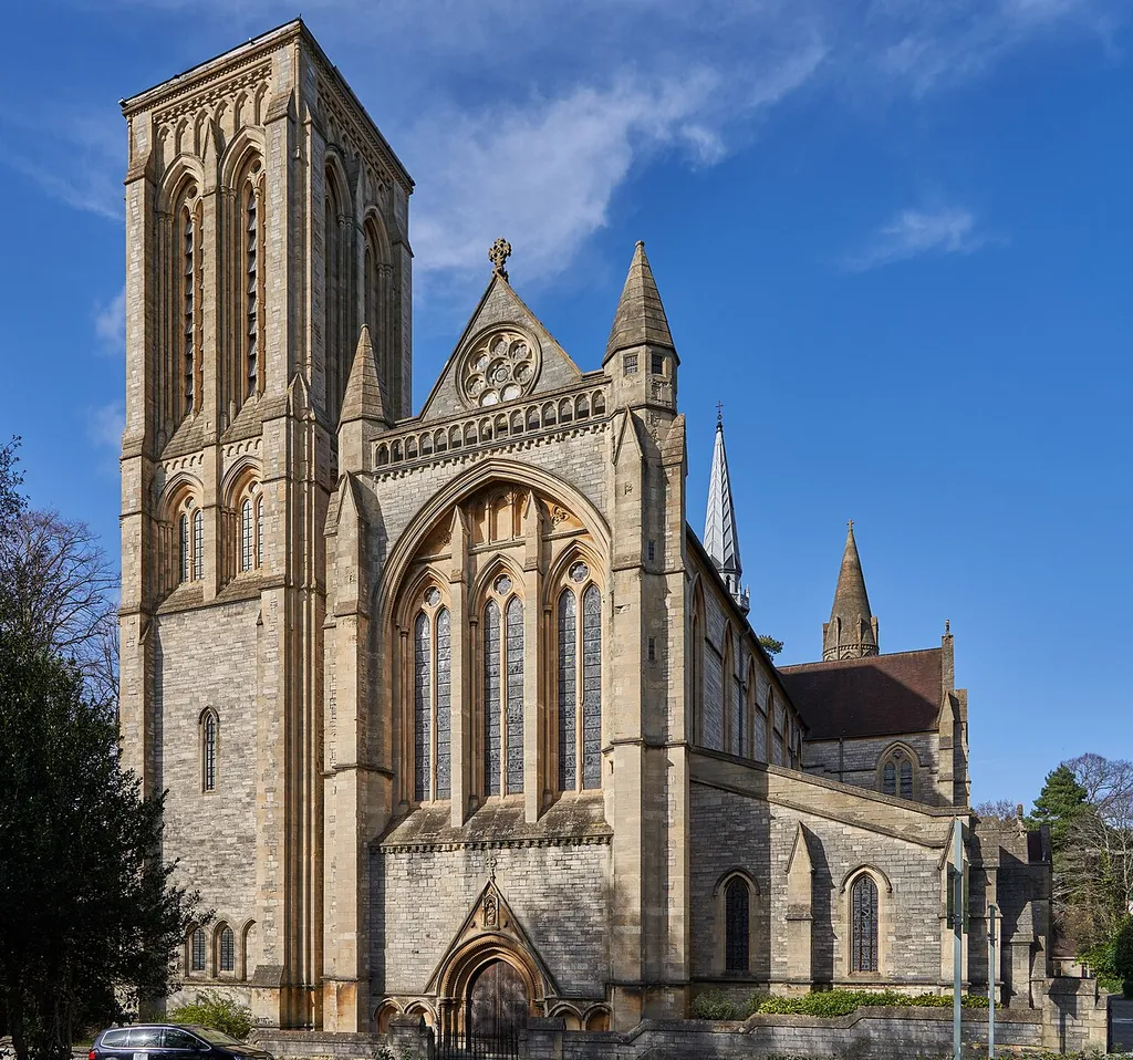 St Stephen’s Church dominates the eastern half of Bournemouth town centre, and is one of the finest Gothic Revival structures in the West Country. Designed by John Loughborough Pearson, architect of Truro Cathedral with which it shares similarities, the main body was built 1881 to 1897. Designed, like Truro, in the Early English style with French influences, it was created as a memorial to the first vicar of St Peter’s Church, Bournemouth’s other splendid Gothic Revival church, designed by George Edmund Street. The exterior is dominated by the huge, but incomplete, north west tower, completed by Pearson’s son Frank to the original design, from 1907 to 1908. A planned slender spire to rival that at St Peter’s was planned, but never finished, and subsequently the tower is capped by a low pyramidal roof. The building has notable French influences, with a flèche over the crossing and several conical towers. The interior is no less splendid, with large lancet and rose windows, purbeck marble columns and ribbed stone vaulting. Open most days, it is a masterpiece, but because it is located away from the main shopping area, is not so heavily visited as St Peter’s.