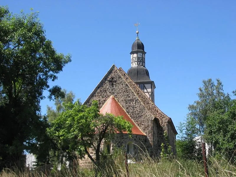 Stone church Borne, built around 1200. The village Borne is an incorporated part of Belzig, the central town of the district Potsdam-Mittelmark in the state Brandenburg of Germany. Belzig appertains to the natural preserve Naturpark Hoher Fläming.