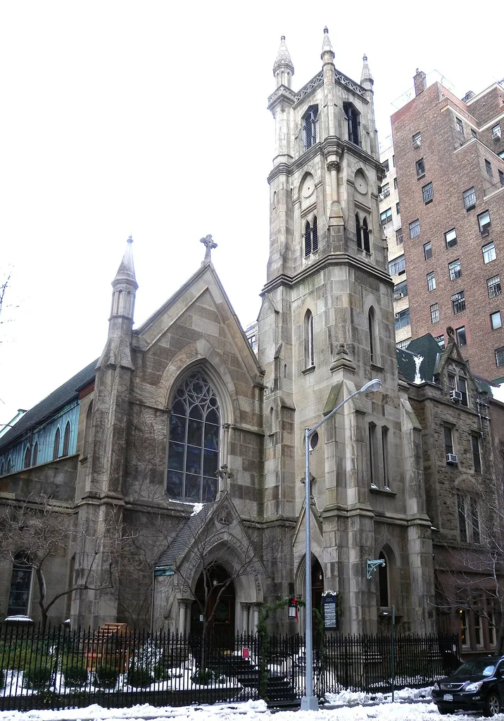 Looking northeast across 89th Street at en:St. Thomas More's Church (New York City), originally owned by the Protestant Episcopal Church as the Chapel of the Beloved Disciple, on a cloudy afternoon. ZIP 10128.