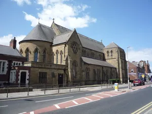 Roman Catholic Church of St Bede and attached Presbytery including attached walls and detached wall to south