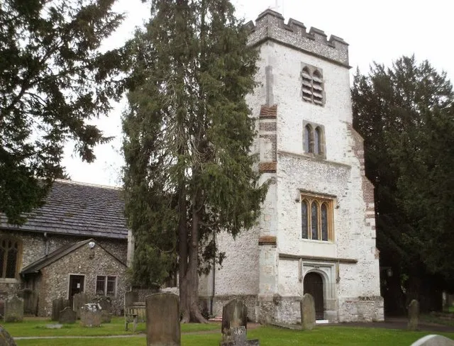 St. Giles' Church, Ashtead. C12th parish church of St. Giles. The church and graveyard are situated in the extensive earthworks of an earlier Roman property and Roman tiles are incorporated into the south wall of the nave. The tower is C15/C16th. The northern extension (to the left of the tower) is C19th.