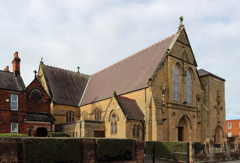 View northwest across Highfield Road. The presbytery, also included in the listing, can be seen to the left.