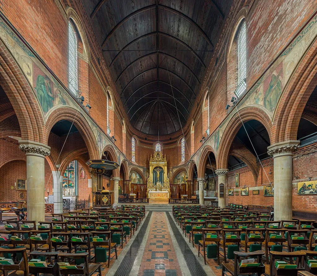 The interior of St Mary's, Bourne Street Church, London, UK, facing north east towards the altar. The Latin writing on the reredos reads 'et regni eius non erit finis' - 'Of his kingdom there shall be no end.' The spandrel paintings are possibly by Nathaniel Westlake.