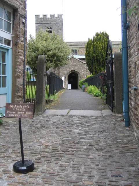 The south gate to St Andrew's, Dent Looking north towards St Andrew's from the south gateway on Main Street.