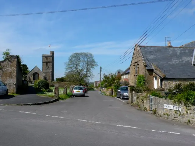 View west-northwest along Church Street, Tintinhull, Somerset, with St Margaret's parish church on the left