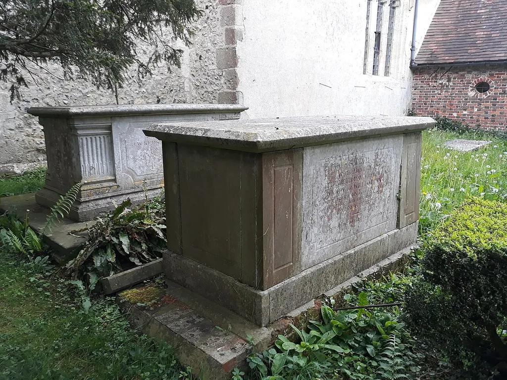 All Saints' Church, Upper Farringdon, Hampshire, England. Two Grade II listed table tombs south of the church.