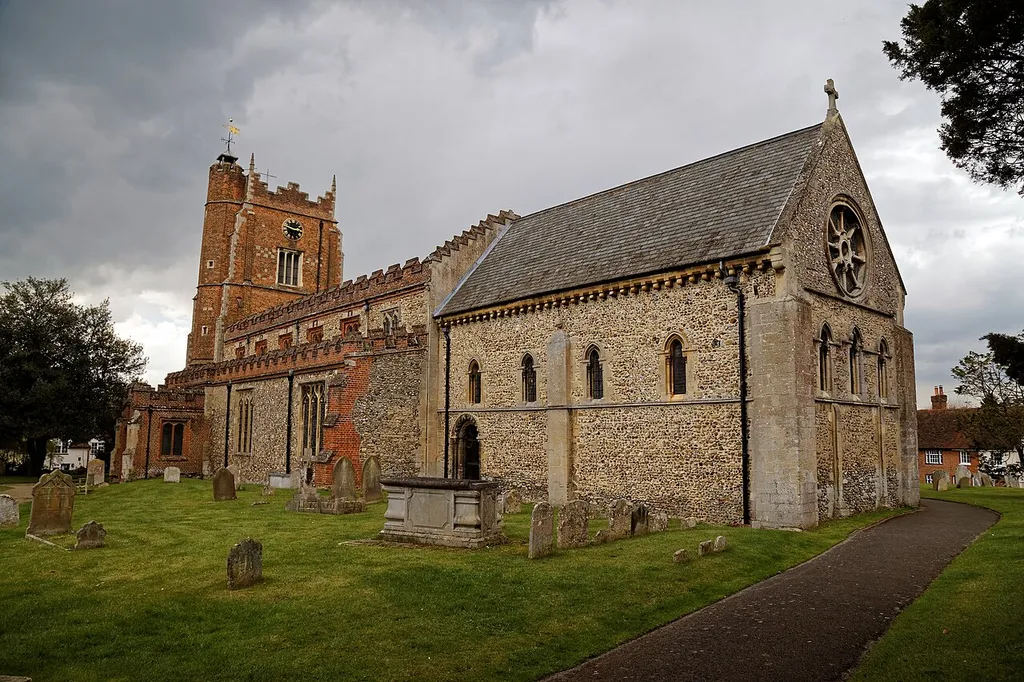 A south-east view of the churchyard, path, and Norman Romanesque chancel of St Nicholas' Church in Castle Hedingham in Essex, England.Camera: Canon EOS 6D with Canon EF 24-105mm F4L IS USM lens.Software: large RAW file lens-corrected, optimized and downsized with DxO OpticsPro 10 Elite, Viewpoint 2, and Adobe Photoshop CS2.