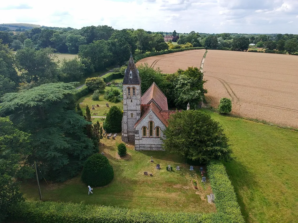 West Woodhay church, with the manor in the background.