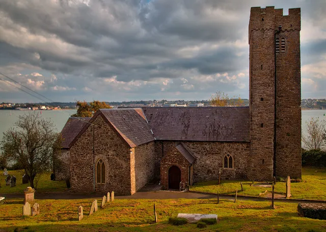 St. Tudwal's Church Llanstadwell. A view of St.Tudwal's looking south across the Haven towards Pembroke Dock.