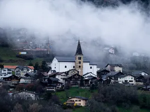 Saint-Romain church with bell tower and surroundings