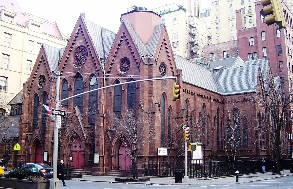 The parish of Calvary Church was founded in 1832, and the current church building`at 273 Park Avenue South on the corner of East 21st Street in Manhattan, New York City was constructed in 1848, designed by James Renwick, Jr. The church's two original wooden towers were removed in the early 20th century because of deterioration -- note the hexagonal stub where the south tower was located. (Sources: Calvary-St. George's Parish website, From Abyssinian to Zion (2004), AIA Guide to NYC (4th ed.))