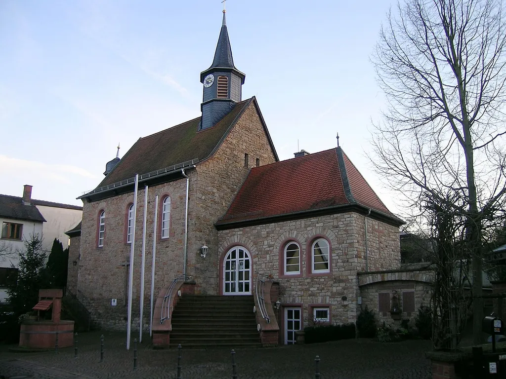 Katholische Filialkirche St. Wendelin, Saalbau mit eingezogenem dreiseitig schließendem Chor, Satteldach und verschieferter Dachreiter mit Spitzhelm auf dem Langhaus, verschieferter Dachreiter mit Zwiebelhaube auf dem Chor, unverputztes Sandsteinmauerwerk mit Werksteinrahmungen, Chor 18. Jahrhundert, Langhausanbau 1934, moderne Anbauten; mit Ausstattung, Sulzbach am Main (Ortsteil Dornau) This is a photograph of an architectural monument.It is on the list of cultural monuments of Sulzbach am Main, no. D-6-76-160-22.