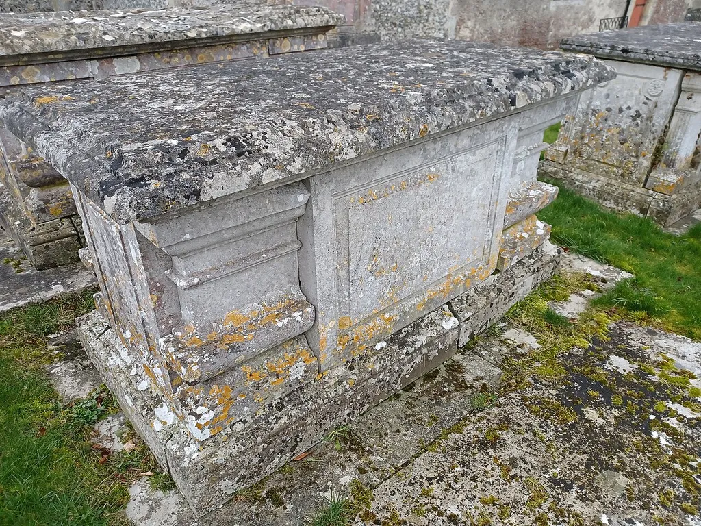Table Tomb 9 Metres North Of Church Of All Saints, Barton Stacey, Hampshire, England. c1800, Grade II listed. .mw-parser-output .messagebox{margin:4px 0;width:auto;border-collapse:collapse;border:2px solid var(--border-color-progressive,#6485d1);background-color:var(--background-color-neutral-subtle,#fbfcff);color:var(--color-base,#202122);box-sizing:border-box;border-inline-start-width:8px}.mw-parser-output .messagebox.mbox-small{font-size:88%;line-height:1.25em}.mw-parser-output .mbox-warning,.mw-parser-output .mbox-speedy{border:2px solid var(--border-color-error,#b22222);background:var(--background-color-error-subtle,#ffdbdb);border-inline-start-width:8px}.mw-parser-output .mbox-serious,.mw-parser-output .mbox-delete,.mw-parser-output .mbox-stop{border:2px solid var(--border-color-error,#b22222);border-inline-start-width:8px}.mw-parser-output .mbox-issue,.mw-parser-output .mbox-content{border:2px solid #f28500;background:var(--background-color-warning-subtle,#ffe);border-inline-start-width:8px}.mw-parser-output .mbox-query,.mw-parser-output .mbox-style{border:2px solid #f4c430;background:var(--background-color-warning-subtle,#ffe);border-inline-start-width:8px}.mw-parser-output .mbox-shit{border:2px solid #960;border-inline-start-width:8px}.mw-parser-output .mbox-license{border:2px solid #88a;border-inline-start-width:initial}.mw-parser-output .mbox-legal{border:2px solid var(--border-color-notice,#666);background:var(--background-color-base,#fff);border-inline-start-width:8px}.mw-parser-output .mbox-honor{border:2px solid #ca3;background:var(--background-color-warning-subtle,#fcf4db);border-inline-start-width:8px}.mw-parser-output .mbox-growth{border:2px solid #8d4;background:var(--background-color-success-subtle,#d5fdf4);border-inline-start-width:8px}.mw-parser-output .mbox-move{border:2px solid #93c;border-inline-start-width:8px}.mw-parser-output .mbox-protection,.mw-parser-output .mbox-message{border:2px solid var(--border-color-base,#aaa);border-inline-star
