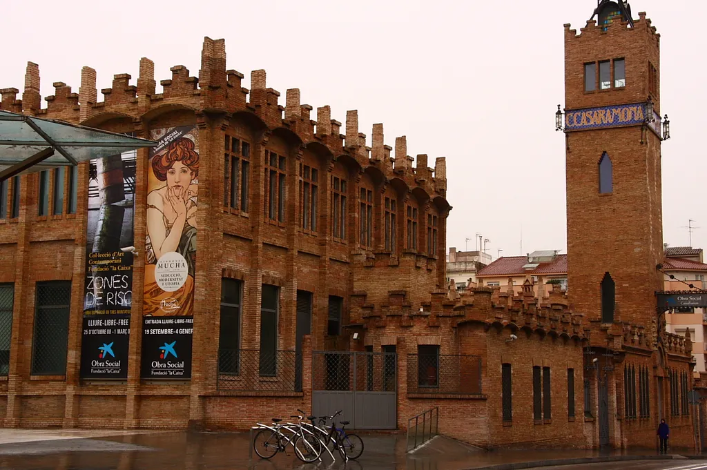 Tower of Casaramona's old factory (Barcelona, Catalunya). Alfons Mucha Exhibition's on desember-2008