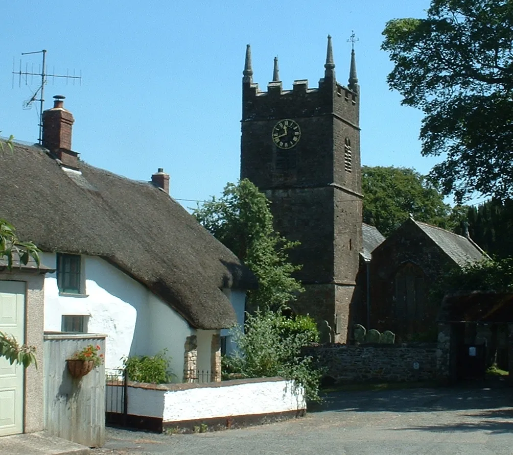 Church and thatched cottage in Northlew, Devon