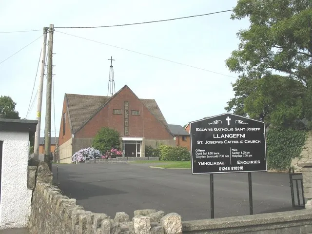 Eglwys Gatholig St Joseff Catholic Church, Penmynydd Road This brick built church, served by the Irish OMI's, was built in 1970. It replaced an earlier church in Bridge Street which dated back to the war years.