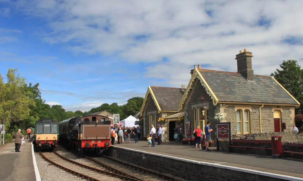 A busy day at Bitton on the Avon Valley Railway. Their diesel multiple unit (with class 107 power car 52025 on the rear) is about to leave for Oldland while former Wemyss Private Railway 'Austerity' number 15 is heading towards Avon Riverside.