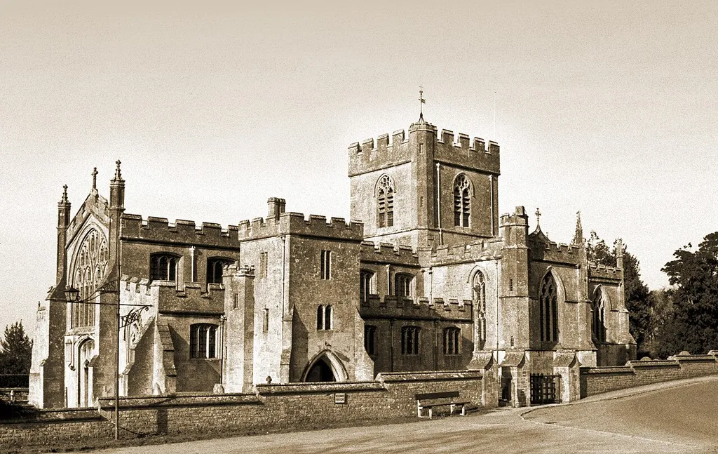 Edington Priory lies at the foot of the escarpment which marks the edge of Salisbury Plain; here it is seen from the south west. The church was built between 1352 and 1361. This image dates from 1999, when I was photographing everything in black and white, on Tri X. The image was scanned and then worked on in Photoshop 3 to make it suitable for printing on an old Epson 750. The resulting master was almost unrescuable for modern Flickr purposes, but I gave it a go in Elements 6. On a previous image, with a similar history, one commenter remarked that there was an interesting use of grain in the sky, to give it texture. Actually the grain was there because I couldn't get rid of it. The image has here been tinted after the style of David J Osborn. There are many other pictures of Edington Priory on Flickr, all of them (at the time of writing) in colour.