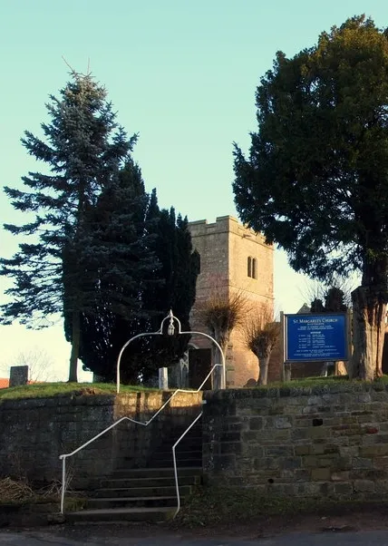 Churchyard steps and west tower of St Margaret's parish church, Bilsthorpe, Nottinghamshire