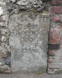 Milestone In Churchyard Wall