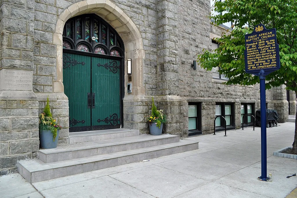 First African Baptist Church. Funded 1809 as one of the first Black Baptist churches in America. Later two members sold themselves into slavery to free a slave to serve as pastor. Erected 1906, this building is located at a later site of the congregation. (Historical Marker at 1600 Christian St., Philadelphia PA - Pennsylvania Historical and Museum Commission 1991)