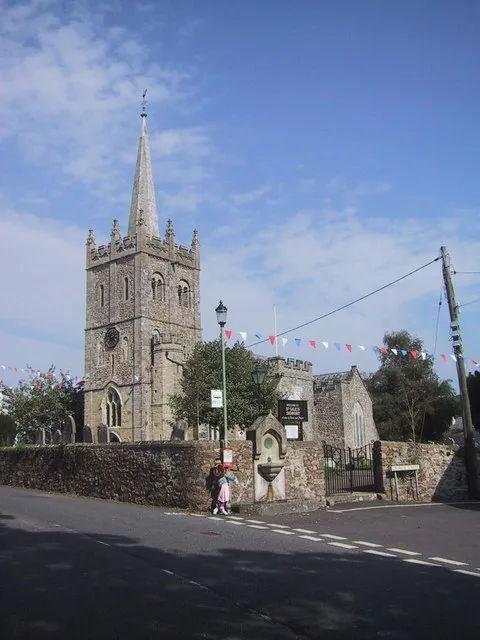Church of England parish church of St Giles &amp; St Peter, Sidbury, Devon: view from the southwest, showing the Norman west tower &amp; Victorian spire