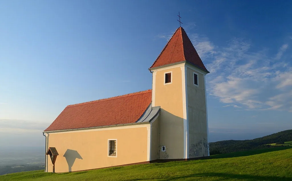 Small church St.Pankrazen on the eastern slope of Masenberg in Styrian village Stambach, near Hartberg. Early morning light.