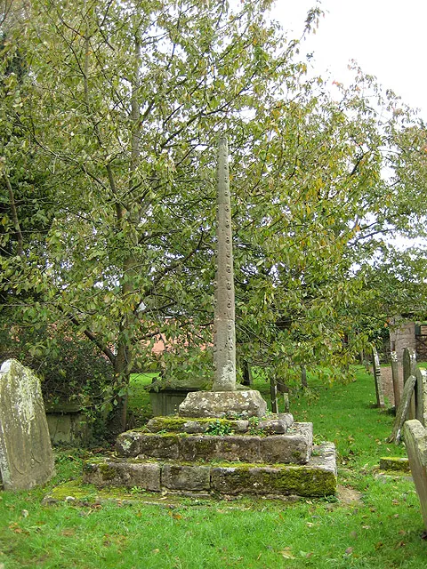 Shaft and base of stone cross in St Michael's parish churchyard, Mitchel Troy, Monmouthshire