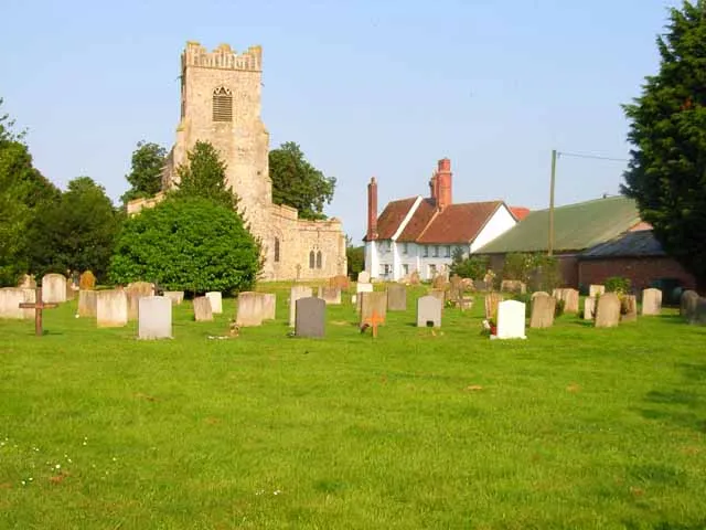 St Bartholomew's parish church, Groton, Suffolk, seen from the west, with Groton Hall centre right
