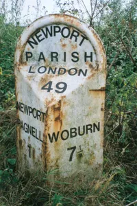 Milepost, London Road; S of Newport Stables, and 300m S of Tickford island (jct with A422)