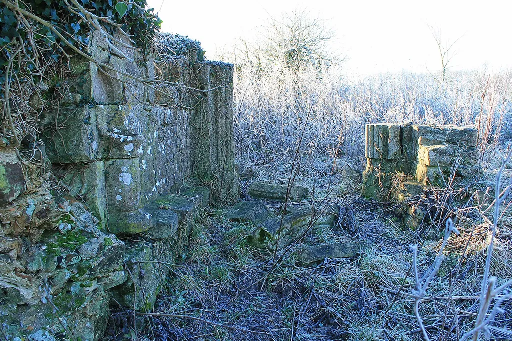 In a circular enclosure in low-lying meadows near the River Frome in Dorset, the ruins of St Mary's Church, East Stoke. The church is thought to be 13th century, with a 15th century porch. The old church was demolished in 1828, the rector arguing that it was in a poor state of repair, too small for the congregation, and difficult to reach when the water meadows flooded. A larger church was built nearby on higher ground.