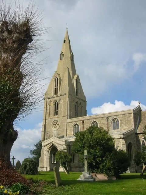 Nave, west tower and spire of All Saints parish church, Buckworth, Cambridgeshire (formerly Huntingdonshire), seen from the south